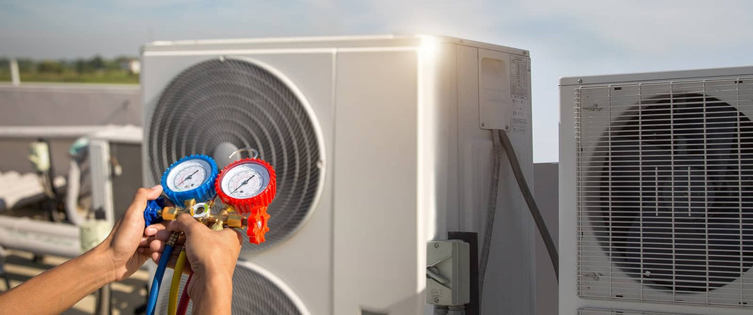 HVAC technician inspecting an air conditioning unit for refrigerant issues.